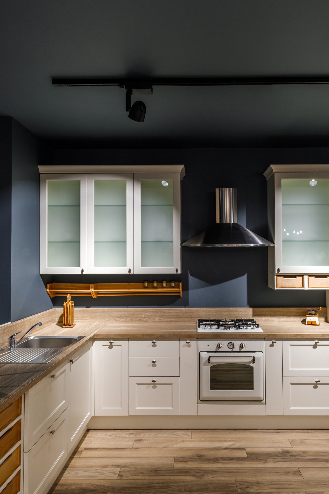 Interior of modern kitchen with white cabinets